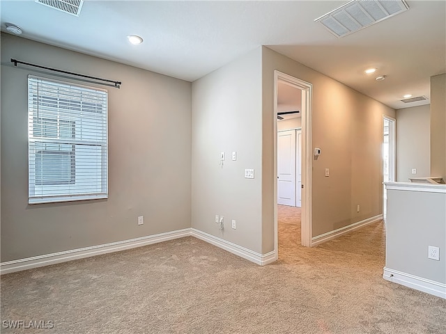 4564 Almada Ln, Wesley Chapel, FL 33543 - unfurnished room featuring light carpet, plenty of natural light, baseboards, and recessed lighting