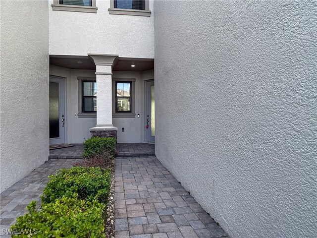 4564 Almada Ln, Wesley Chapel, FL 33543 - entrance to property featuring stucco siding