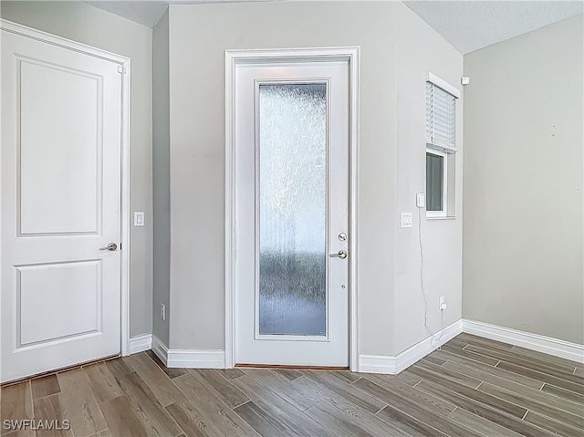 4564 Almada Ln, Wesley Chapel, FL 33543 - foyer featuring wood finished floors and baseboards