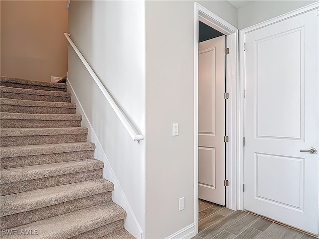 4564 Almada Ln, Wesley Chapel, FL 33543 - staircase featuring wood finished floors
