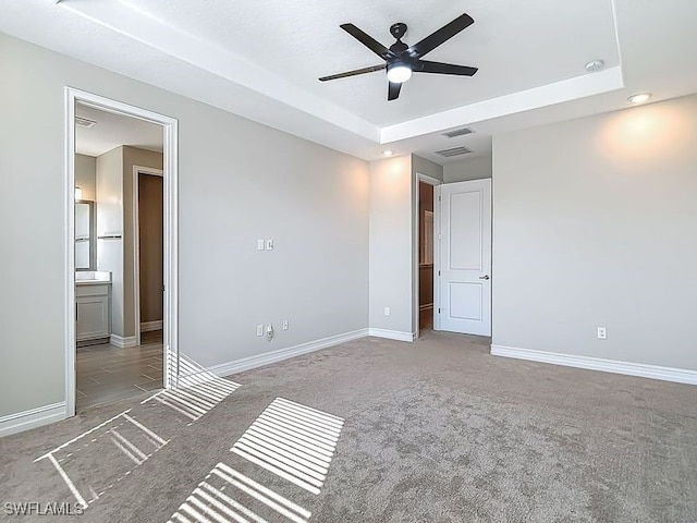 4564 Almada Ln, Wesley Chapel, FL 33543 - unfurnished bedroom featuring a tray ceiling, baseboards, and recessed lighting