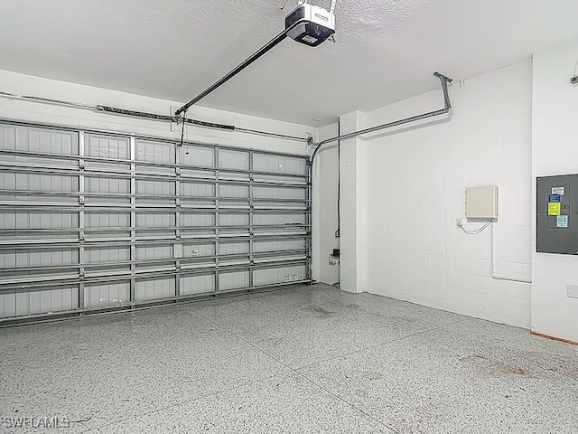 4564 Almada Ln, Wesley Chapel, FL 33543 - garage featuring a garage door opener, electric panel, and concrete block wall