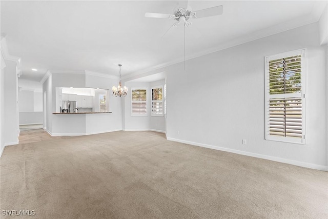 2432 Ravenna Blvd Unit 4, Naples, FL 34109 - unfurnished living room featuring ornamental molding, a chandelier, a ceiling fan, carpet flooring, and plenty of natural light