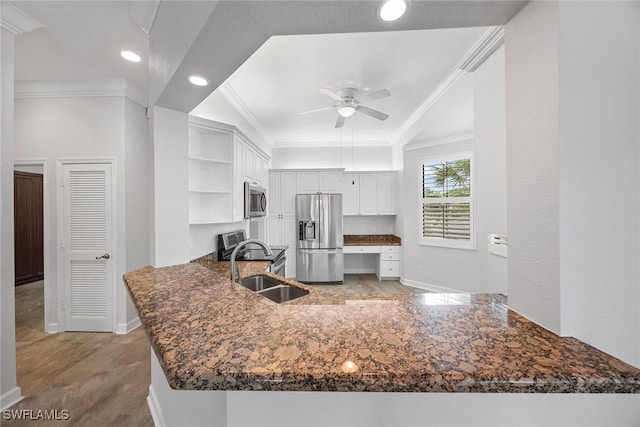 2432 Ravenna Blvd Unit 4, Naples, FL 34109 - kitchen with stainless steel appliances, open shelves, a peninsula, a ceiling fan, and ornamental molding