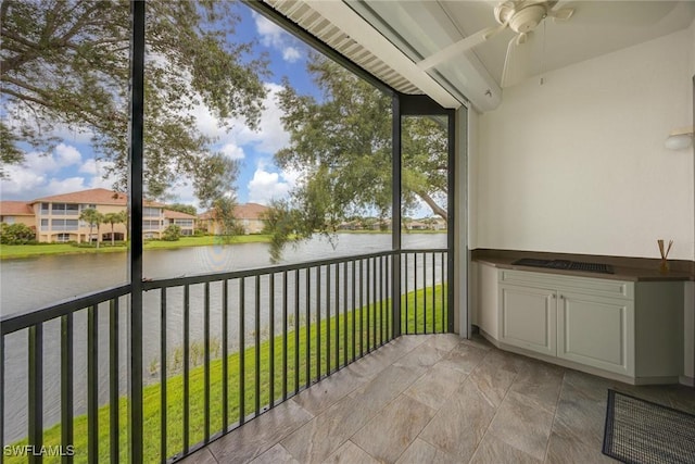 2432 Ravenna Blvd Unit 4, Naples, FL 34109 - unfurnished sunroom featuring a ceiling fan and a water view
