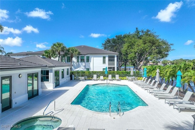 2432 Ravenna Blvd Unit 4, Naples, FL 34109 - community pool with a patio and a hot tub