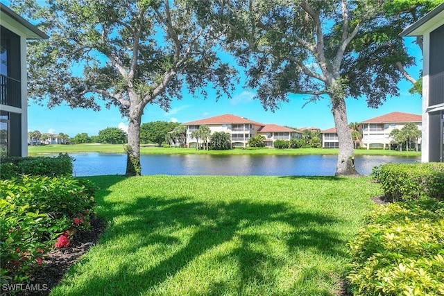 2432 Ravenna Blvd Unit 4, Naples, FL 34109 - view of green lawn with a water view