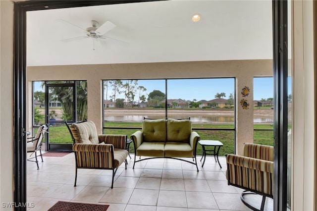 24979 Paradise Rd, Bonita Springs, FL 34135 - sunroom / solarium featuring ceiling fan, a water view, plenty of natural light, and lofted ceiling