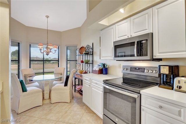 24979 Paradise Rd, Bonita Springs, FL 34135 - kitchen featuring appliances with stainless steel finishes, a chandelier, light tile patterned floors, white cabinetry, and light countertops