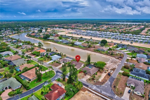 24979 Paradise Rd, Bonita Springs, FL 34135 - aerial view of property and surrounding area with nearby suburban area and a large body of water
