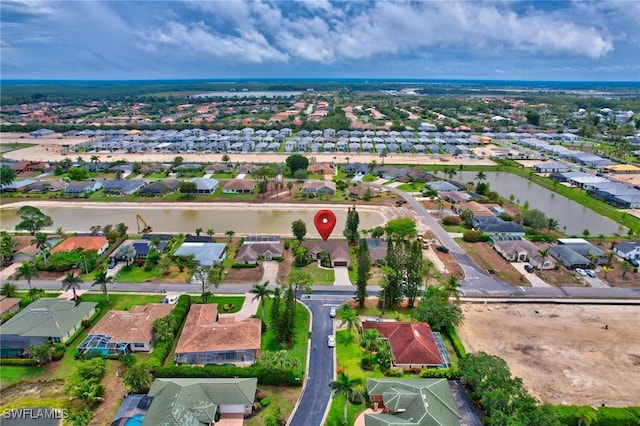 24979 Paradise Rd, Bonita Springs, FL 34135 - aerial overview of property's location with nearby suburban area and a large body of water