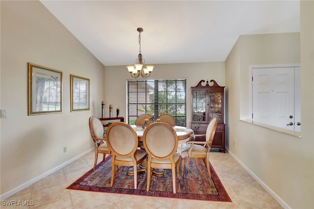 24979 Paradise Rd, Bonita Springs, FL 34135 - dining room with a chandelier, baseboards, light tile patterned flooring, and vaulted ceiling