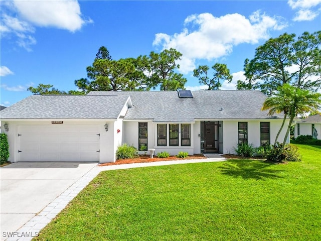 15138 Sam Snead Ln, North Fort Myers, FL 33917 - ranch-style home with an attached garage, a front yard, a shingled roof, and concrete driveway