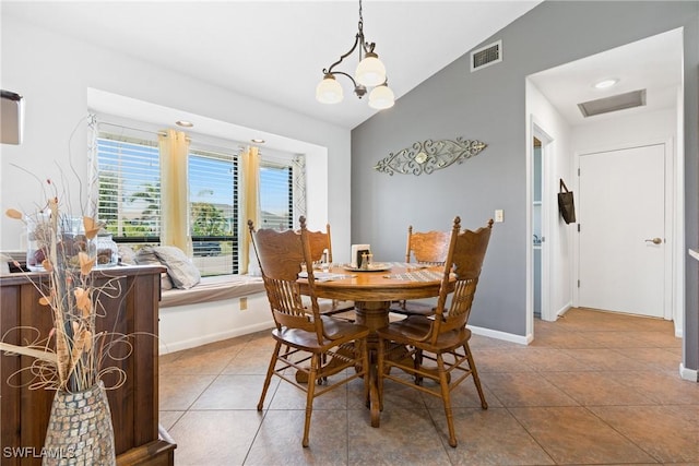 15138 Sam Snead Ln, North Fort Myers, FL 33917 - dining room featuring baseboards, tile patterned flooring, and vaulted ceiling