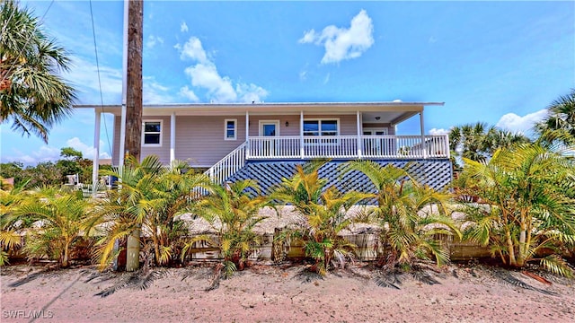 8161 Moyer Ln, Bokeelia, FL 33922 - view of front of home with fence and a porch