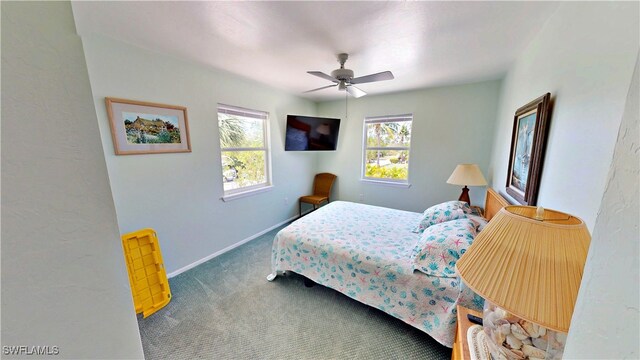 8161 Moyer Ln, Bokeelia, FL 33922 - bedroom with carpet flooring, baseboards, and ceiling fan