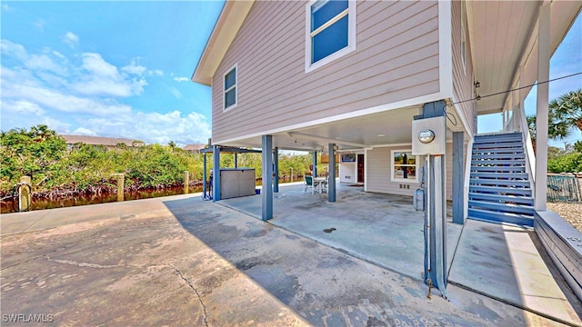 8161 Moyer Ln, Bokeelia, FL 33922 - view of patio with a carport and stairway
