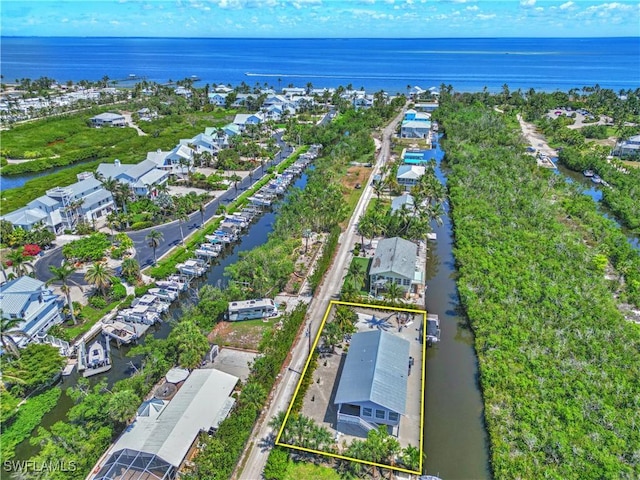 8161 Moyer Ln, Bokeelia, FL 33922 - aerial perspective of suburban area featuring a large body of water and property parcel outlined