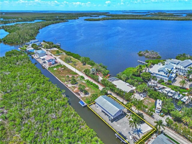 8161 Moyer Ln, Bokeelia, FL 33922 - aerial overview of property's location featuring a large body of water and property parcel outlined