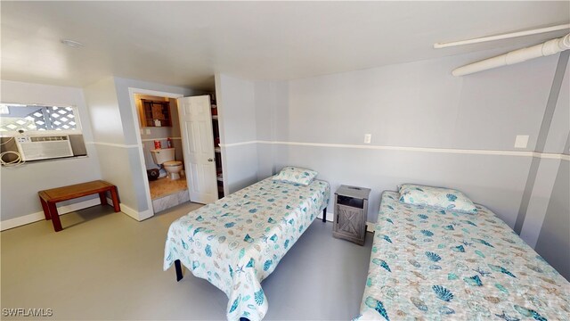 8161 Moyer Ln, Bokeelia, FL 33922 - bedroom featuring cooling unit, carpet flooring, and baseboards