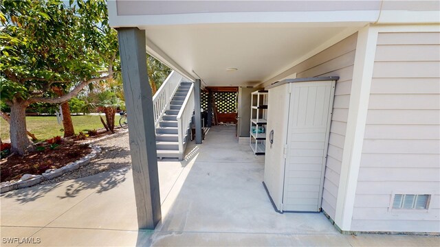 8161 Moyer Ln, Bokeelia, FL 33922 - view of patio / terrace featuring stairs