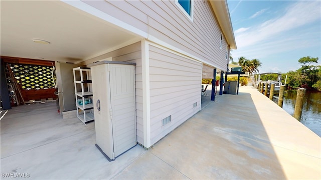 8161 Moyer Ln, Bokeelia, FL 33922 - view of patio / terrace featuring a water view and a boat dock