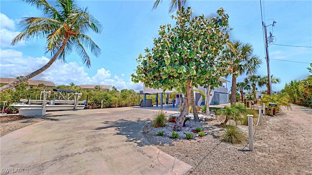 8161 Moyer Ln, Bokeelia, FL 33922 - view of home's exterior with a carport and driveway