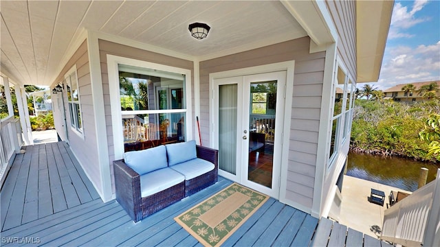 8161 Moyer Ln, Bokeelia, FL 33922 - wooden terrace with a water view