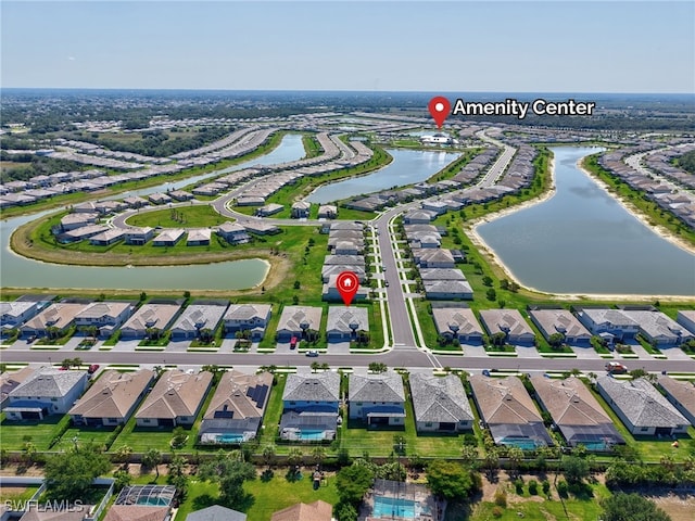 aerial view of residential area with a nearby body of water