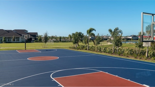 view of basketball court featuring community basketball court and a lawn