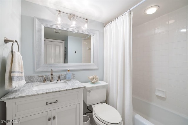 full bath featuring toilet, vanity, and shower / tub combo
