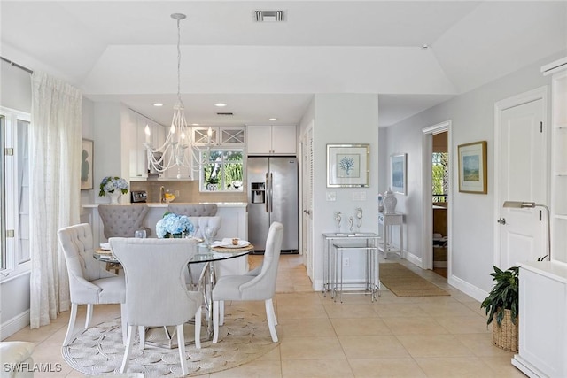 dining area featuring a chandelier, vaulted ceiling, baseboards, light tile patterned floors, and recessed lighting