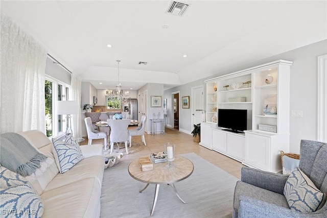 living area with a chandelier, light tile patterned floors, baseboards, and recessed lighting