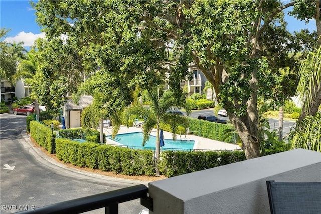 view of property's community with a pool