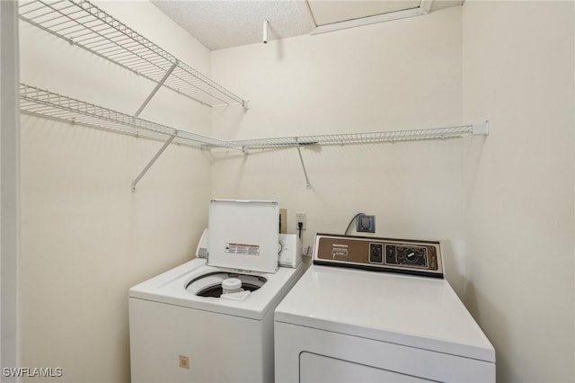 washroom with separate washer and dryer