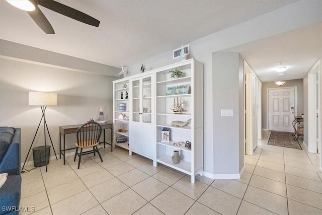 26740 Rosewood Pointe Ln Unit 102, Bonita Springs, FL 34135 - sitting room featuring tile patterned flooring, a ceiling fan, and baseboards