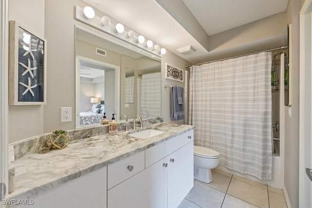 26740 Rosewood Pointe Ln Unit 102, Bonita Springs, FL 34135 - ensuite bathroom featuring vanity, toilet, tile patterned floors, and shower / bathtub combination with curtain