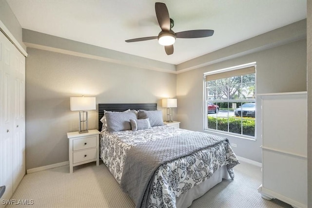 26740 Rosewood Pointe Ln Unit 102, Bonita Springs, FL 34135 - bedroom featuring light colored carpet, a closet, baseboards, and a ceiling fan