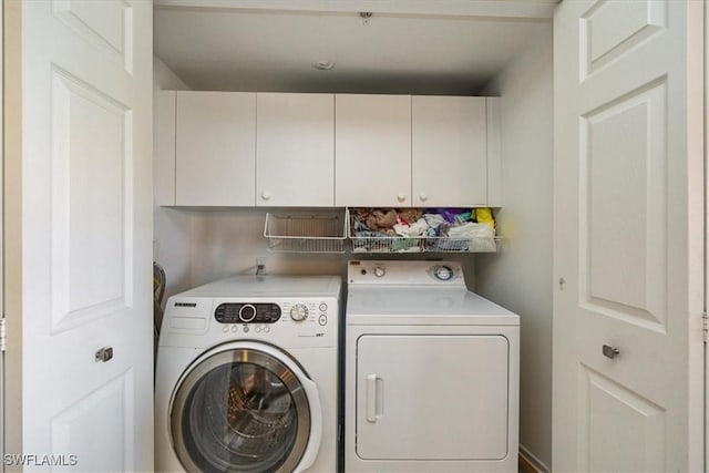 26740 Rosewood Pointe Ln Unit 102, Bonita Springs, FL 34135 - laundry area with washing machine and dryer and cabinet space