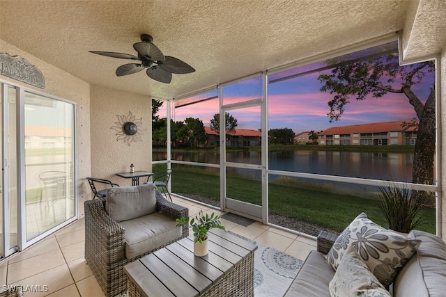 26740 Rosewood Pointe Ln Unit 102, Bonita Springs, FL 34135 - sunroom / solarium featuring a water view, ceiling fan, and outdoor lounge area