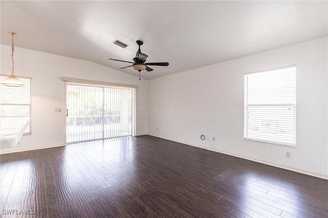 497 Bethany Village Cir, Lehigh Acres, FL 33936 - spare room with a ceiling fan, vaulted ceiling, dark wood-style flooring, and baseboards