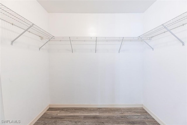 497 Bethany Village Cir, Lehigh Acres, FL 33936 - spacious closet featuring wood finished floors