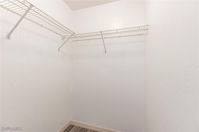 497 Bethany Village Cir, Lehigh Acres, FL 33936 - spacious closet with wood finished floors