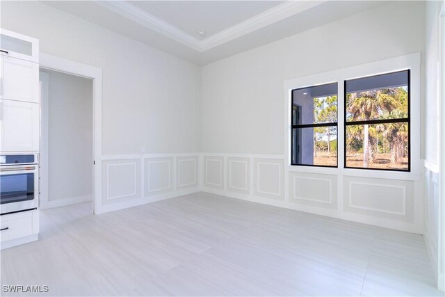 2583 18th Ave SE, Naples, FL 34117 - empty room with ornamental molding and a decorative wall