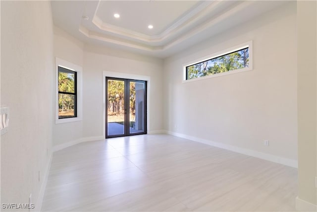 2583 18th Ave SE, Naples, FL 34117 - unfurnished room with healthy amount of natural light, french doors, light wood-type flooring, recessed lighting, and baseboards