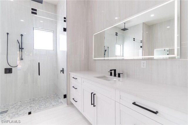 2583 18th Ave SE, Naples, FL 34117 - bathroom with a shower stall and vanity