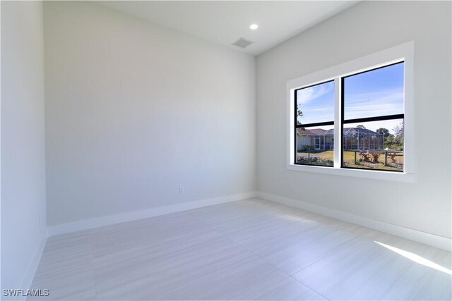 2583 18th Ave SE, Naples, FL 34117 - spare room featuring baseboards and recessed lighting
