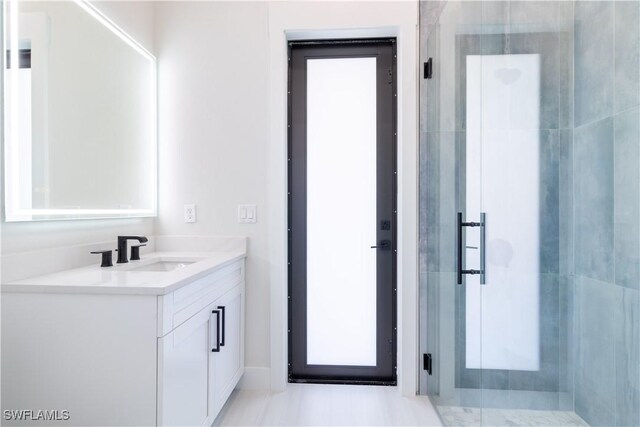 2583 18th Ave SE, Naples, FL 34117 - bathroom featuring a shower stall and vanity