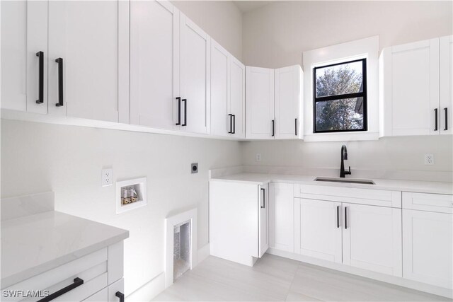 2583 18th Ave SE, Naples, FL 34117 - clothes washing area featuring cabinet space, hookup for a washing machine, and electric dryer hookup