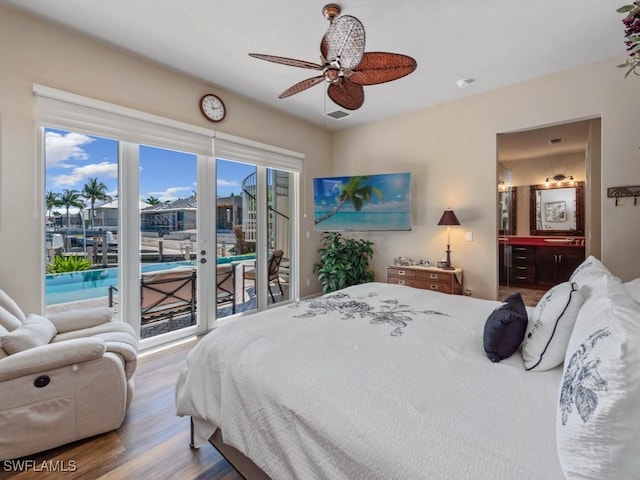 622 Bimini Ave, Marco Island, FL 34145 - bedroom with access to outside, wood finished floors, ensuite bath, and a ceiling fan